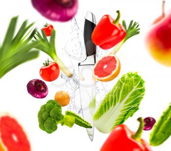 Kitchen knife and fresh vegetables, healthy lifestyle concept. Vegetarian cuisine, organic food cooking, isolated