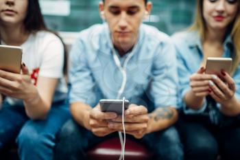 Modern youth using phones in subway, addiction problem, social addicted people
