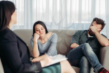 Stressed couple, patients at psychologist reception, civilized solution to the problem. Female doctor helps with consultation, family psychology support
