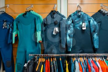 Showcase with cycling suits in sports shop, nobody. Summer active leisure, showcase with biking clothes, professional bicycle equipment