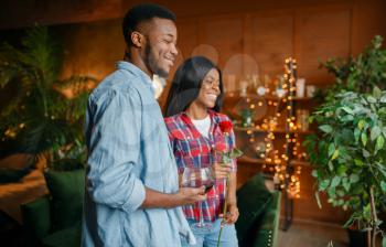 Black couple at home. Happy african love couple leisures in their house, cheerful family relaxing together