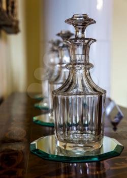 Glass decanters on the table, Europe museum, nobody. Old european architecture and style, famous places for travel and tourism
