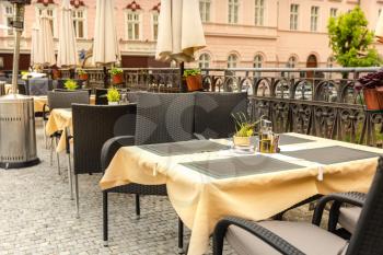 Cosy outdoor cafe with rattan furniture, Karlovy Vary, Czech Republic, Europe. Old european town, famous place for travel and tourism