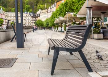Benches on a tourist street, Karlovy Vary, Czech Republic, Europe. Old european town, famous place for travel and tourism