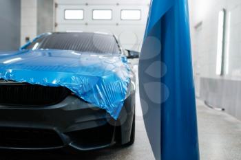 Car wrapping, protective vinyl foil or film installation on the vehicle, nobody. Auto detailing. Automobile paint protection, professional tuning