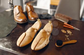 Shoemaker tools, footwear repair service, nobody. Shoemaking workshop, bootmaker equipment on the table, cobbler job