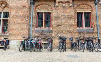 Bicycle parking, ancient provincial European town. Traditional architecture. Summer tourism and travels, famous europe landmark, popular places for travelling