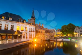 Belgium, Brugge, old European town with buildings on river, night view. Tourism and travels, famous europe landmark