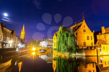 Belgium, Brugge, ancient European town with river channels, night cityscape, panoramic view. Tourism and travel, famous europe landmark, popular places