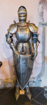 Knight's armor in old castle, ancient stone building, Europe. Traditional european architecture, famous places for tourism and travel, historical heritage