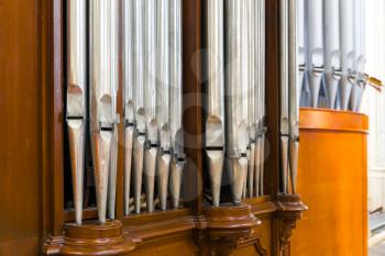 Organ pipes closeup, antique musical instrument in cathedral church, Europe. European famous places for tourism and travel