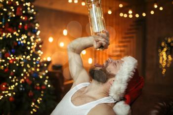 Bad Santa claus drinks alcohol, nasty party. Unhealthy lifestyle, bearded man in holiday costume, new year and alcoholism