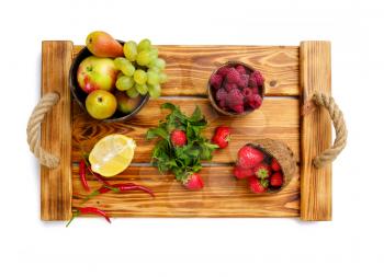 Fresh vegetables, fruits and berries on wooden board, isolated on white background. Organic vegetarian food, grocery products, healthy lifestyle concept