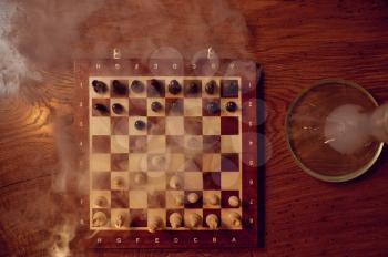 Chessboard in hookahs bar, nobody, top view. Shisha smoking equipment, traditional smoke culture, tobacco aroma for relaxation