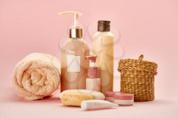 Skin care products on pink background, nobody. Healthcare procedures concept, hygiene cosmetic, healthy lifestyle, spa