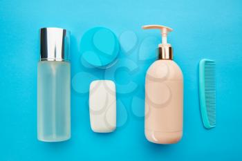 Care products on blue background, nobody. Healthcare procedures concept, fashion cosmetic. Healthcare procedures concept, hygiene tools, healthy lifestyle