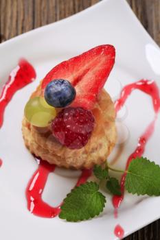 Custard filled puff pastry shell topped with fruit
