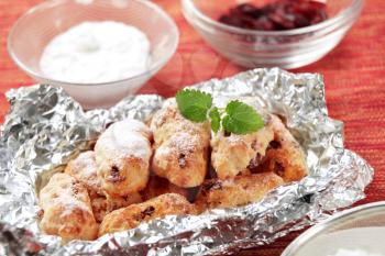 Mini Christmas stollen cakes in aluminum foil