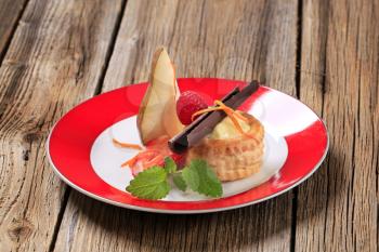 Cream filled puff pastry shell garnished with fresh fruit