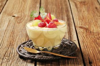 Bowl of creamy pudding with fresh fruit