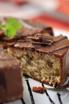 Delicious nut cake glazed with chocolate icing  