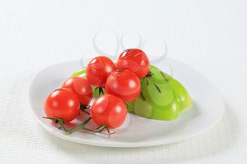 Tomatoes and bell peppers on plate