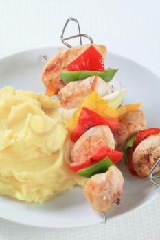 Chicken skewers served with mashed potato