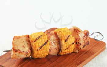 Grilled chicken and sweet corn on skewer 