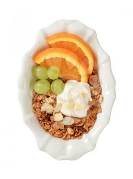 Bowl of breakfast cereals with fresh fruit and quark