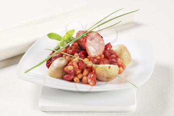 Red beans and corn in tomato sauce with sausage and potatoes