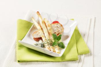 White asparagus spears and chicken breast