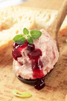 Liver pate on a wooden spoon and bread