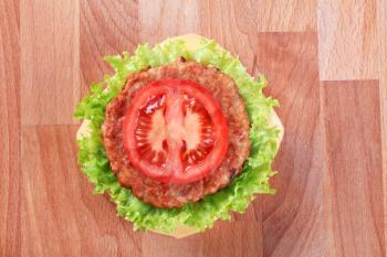 Overhead view of a cheeseburger - closeup