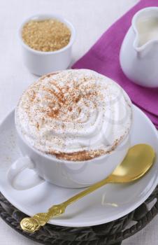 Cup of coffee with whipped cream