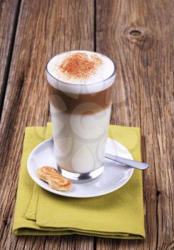 Glass of Latte macchiato with a dusting of nutmeg 