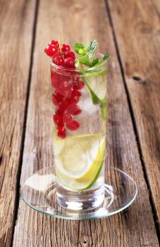 Glass of iced drink with fresh fruit
