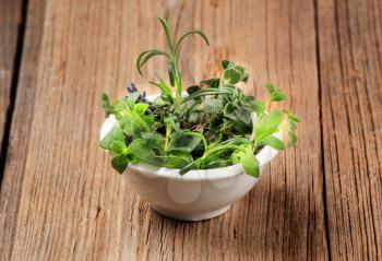 Variety of fresh culinary herbs in a bowl