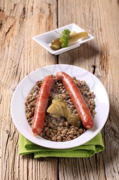 Cooked lentil with spicy sausages and pickles