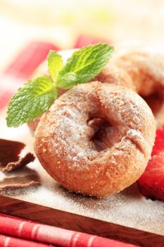 Ring doughnuts sprinkled with icing sugar - detail