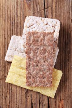 Variety of crispbread on wood - overhead