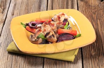 Chicken skewer and pan roasted vegetables and mushrooms