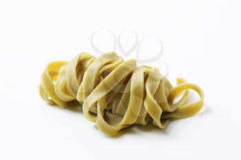 Cooked spinach ribbon pasta - studio shot