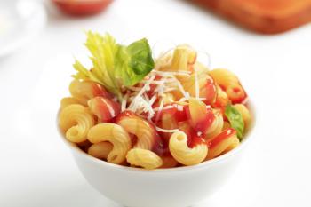 Bowl of pasta with tomato sauce and cheese