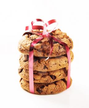 Chocolate chip cookies tied with a red ribbon
