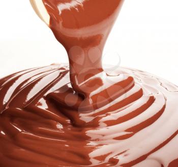 Sweet chocolate sauce being poured
