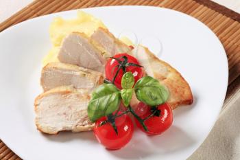 Slices of chicken breast fillet and mashed potato