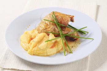 Roasted chicken quarter served with mashed potato