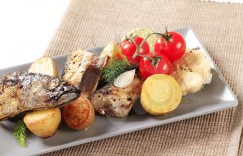 Pieces of crispy spiced mackerel with new potatoes