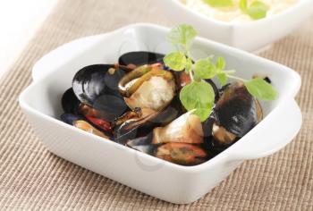 Delicious steamed mussels in a ceramic dish
