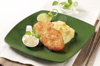 Fried breaded fish served with mashed potato